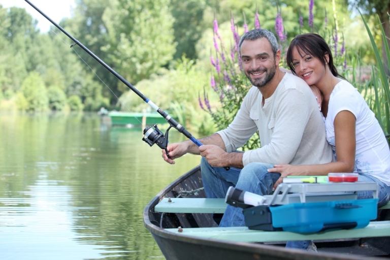 Couple embracing while fishing.