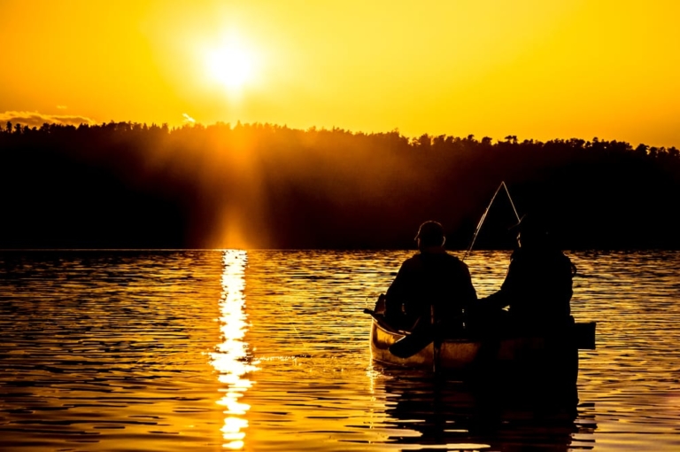 Fishermen on the lake at sunrise.