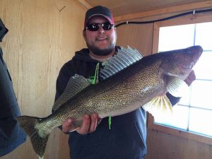 Paul holding a large walleye.